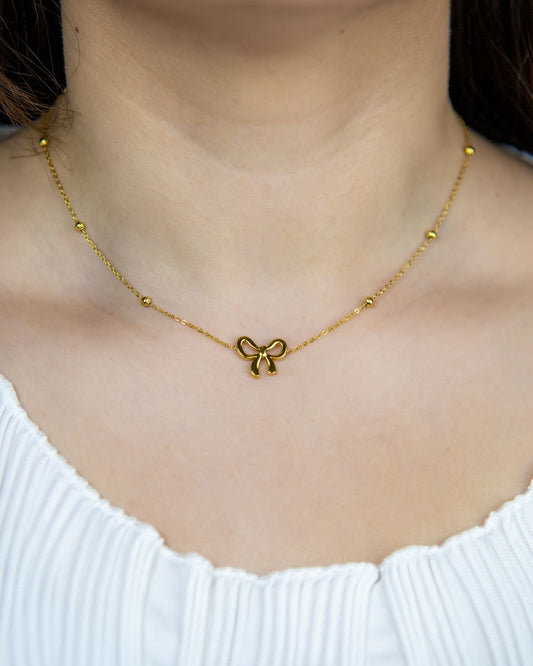 Golden Bow Pendant Necklace – Playful Elegance with a Feminine Twist